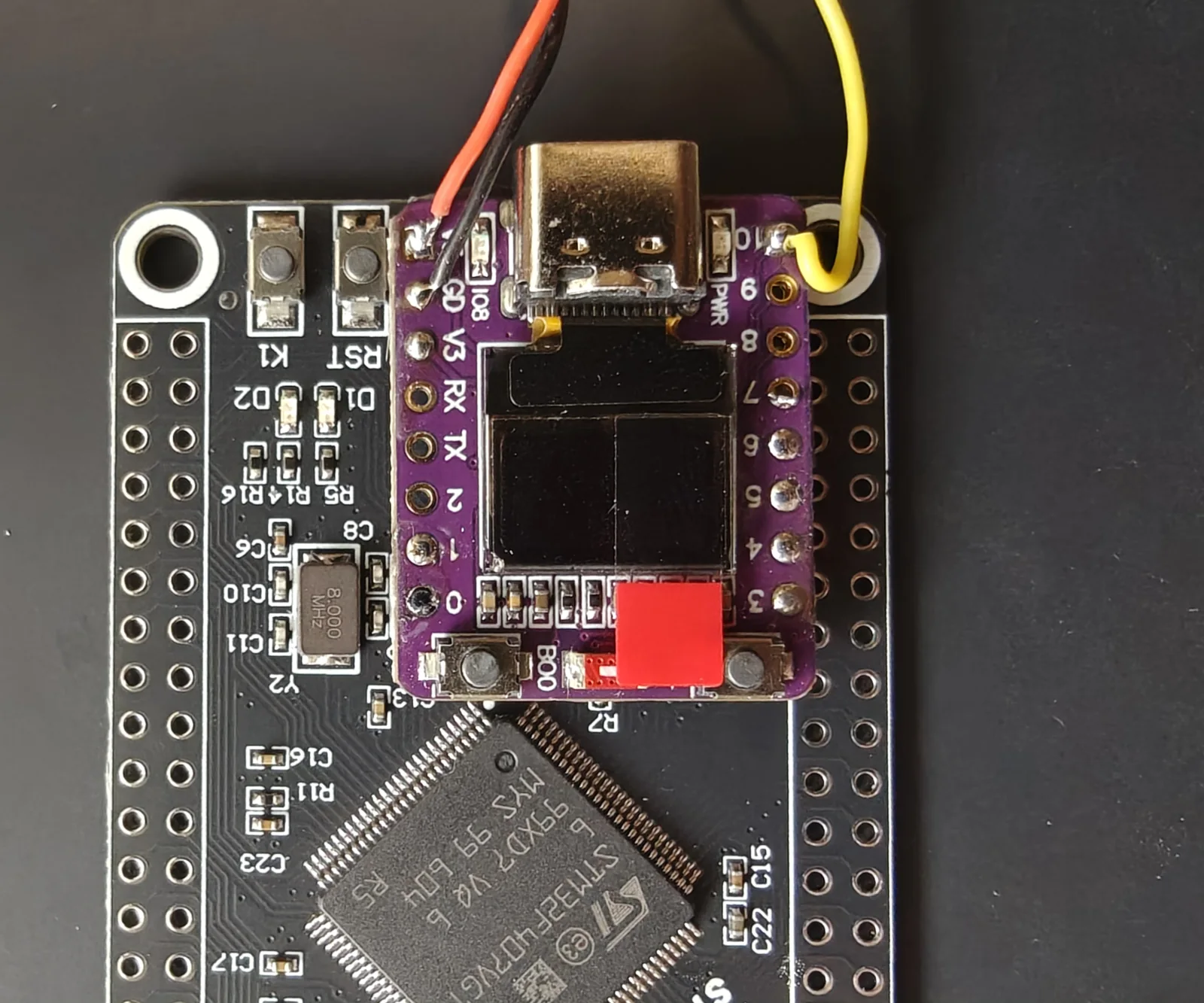 The bridge board mounted on top of the flight computer, over the microSD slot