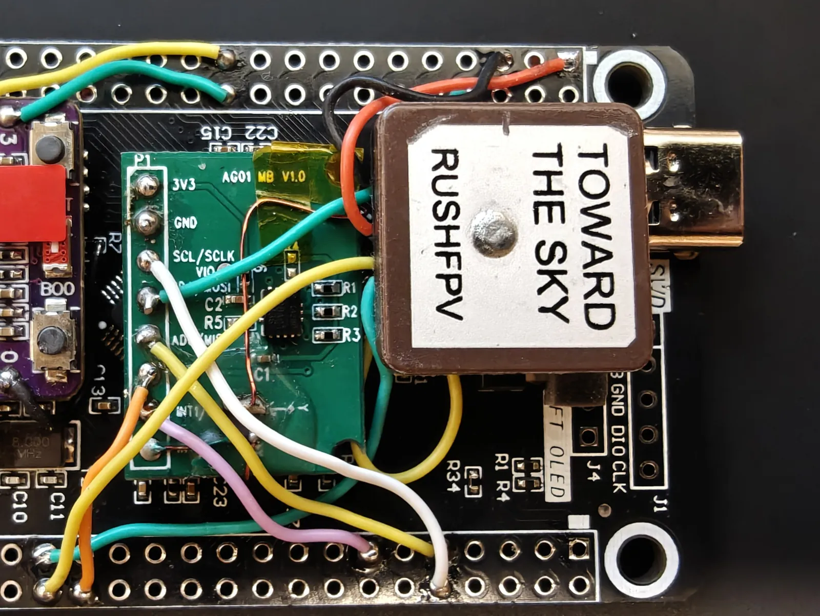 The GPS mounted on the flight computer with its TOWARD THE SKY face upward