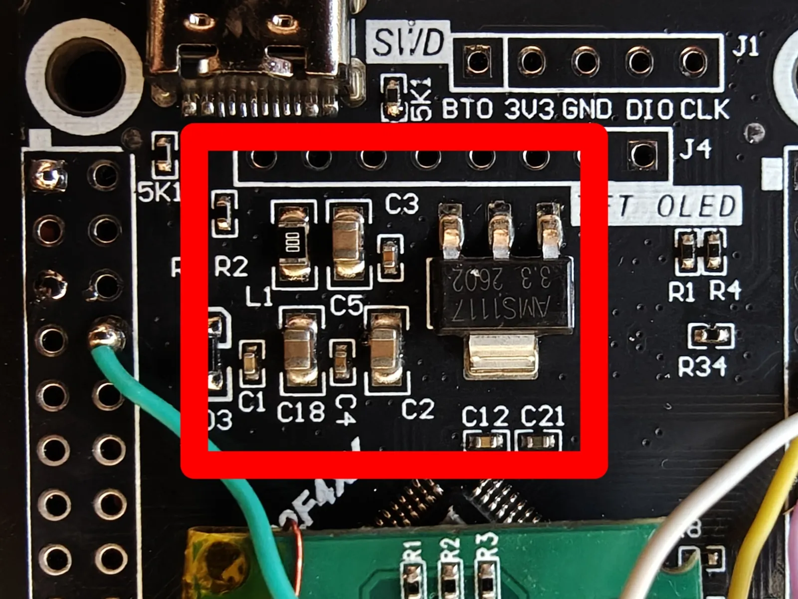 The suggested mounting area on the flight computer, between J4 and the STM32, marked in red