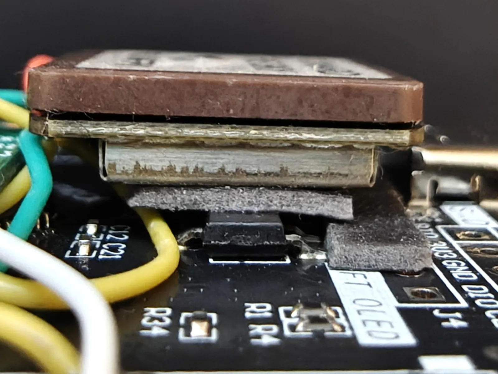 Side view of the mounted module, showing the tape packing filling in around the taller components