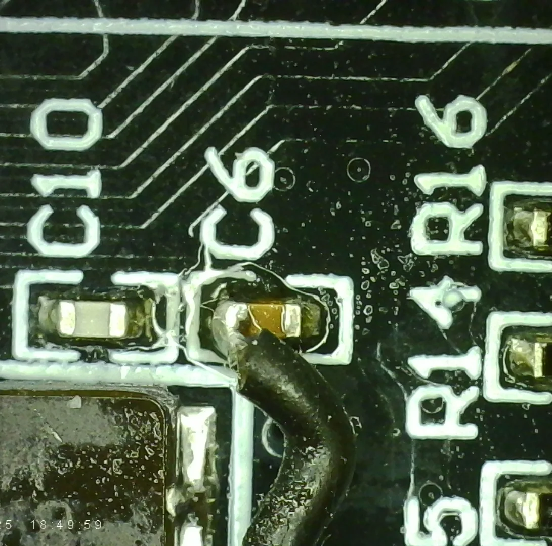 Wire soldered to C6, the NRST capacitor